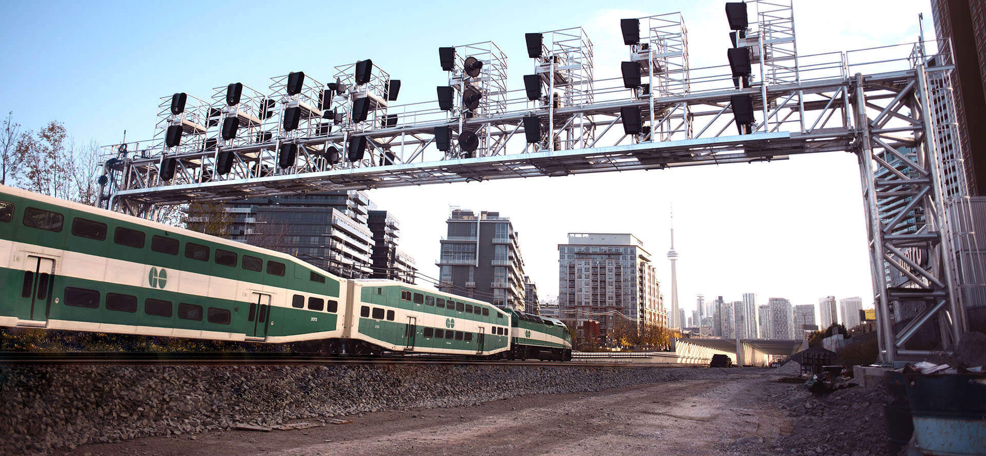 A group of workers wave at a departing train.