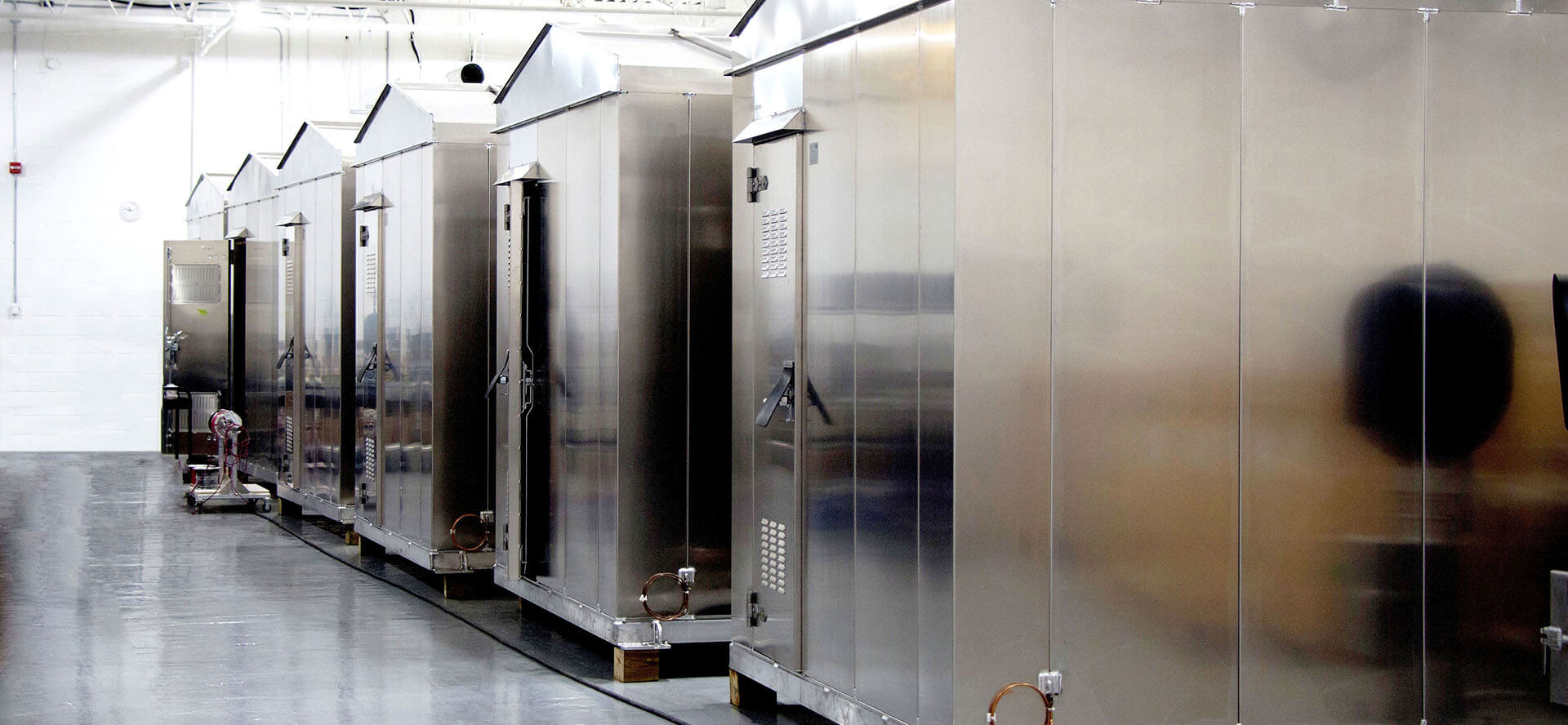 A glossy train in a train station.